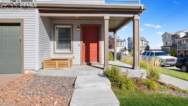 doorway to property with a garage