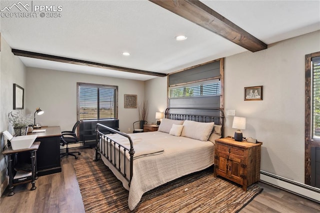 bedroom featuring multiple windows, wood-type flooring, baseboard heating, and beamed ceiling