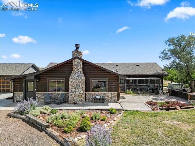 rear view of property featuring a patio