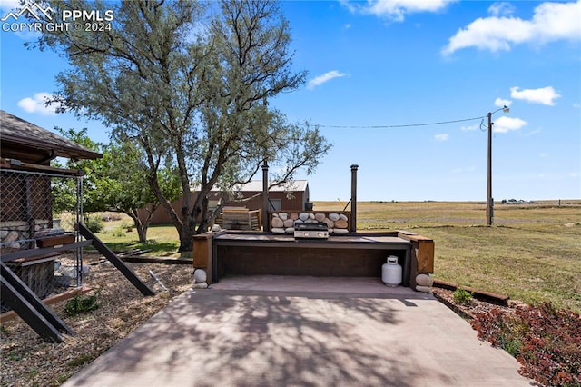 view of patio with a rural view