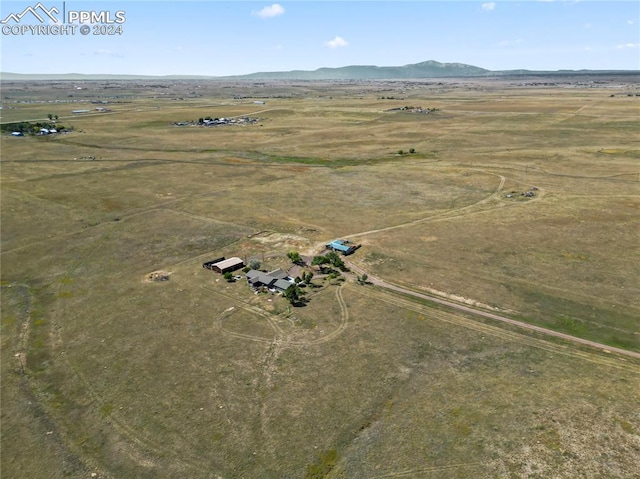 aerial view with a mountain view and a rural view