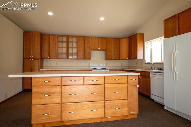 kitchen with lofted ceiling, a kitchen island, dark colored carpet, sink, and white appliances