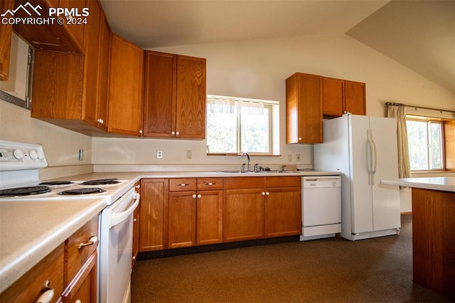 kitchen with white appliances, lofted ceiling, sink, and a wealth of natural light