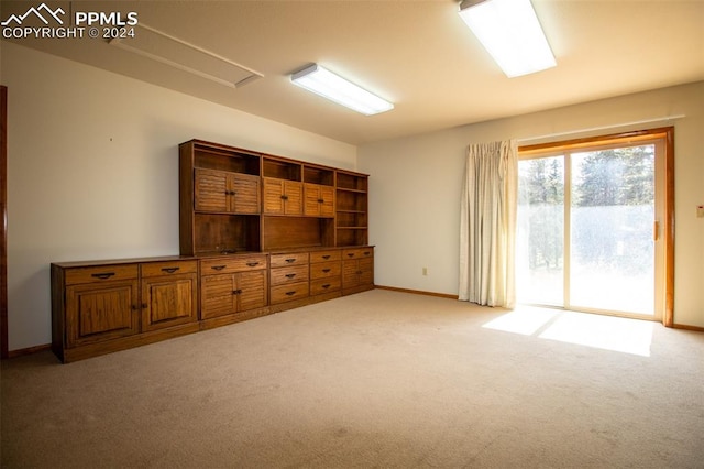 interior space featuring light carpet