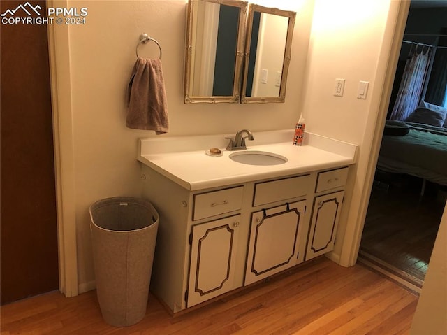 bathroom with vanity and hardwood / wood-style floors