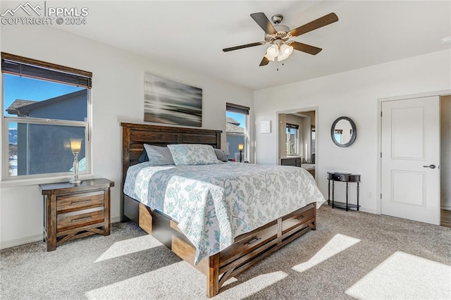 carpeted bedroom with ceiling fan