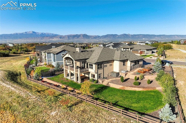 birds eye view of property with a mountain view