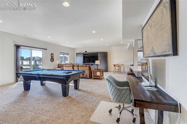 game room featuring light colored carpet, a textured ceiling, and billiards