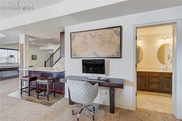 carpeted office featuring sink