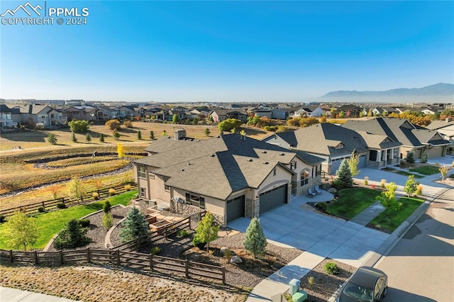 drone / aerial view featuring a mountain view