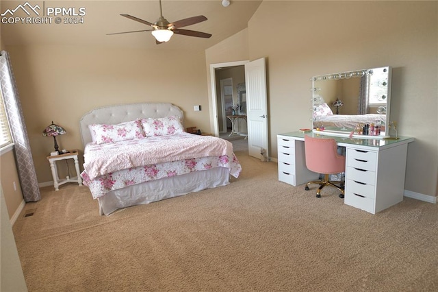 carpeted bedroom with ceiling fan and high vaulted ceiling