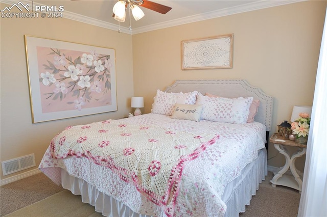 carpeted bedroom with ornamental molding and ceiling fan