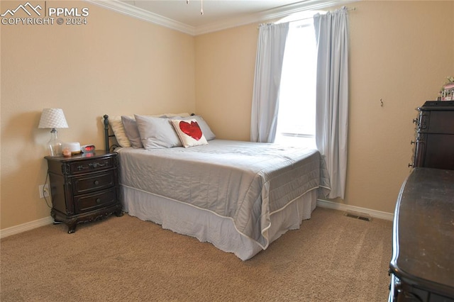 bedroom with multiple windows, ornamental molding, and light carpet