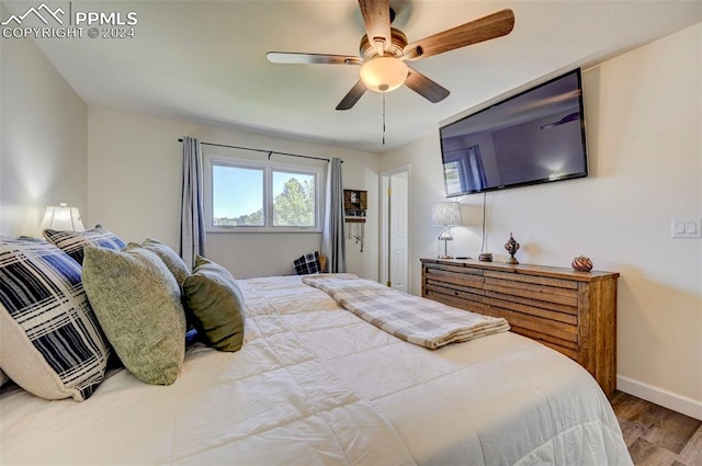 bedroom featuring wood-type flooring and ceiling fan