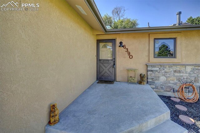 property entrance with a patio area