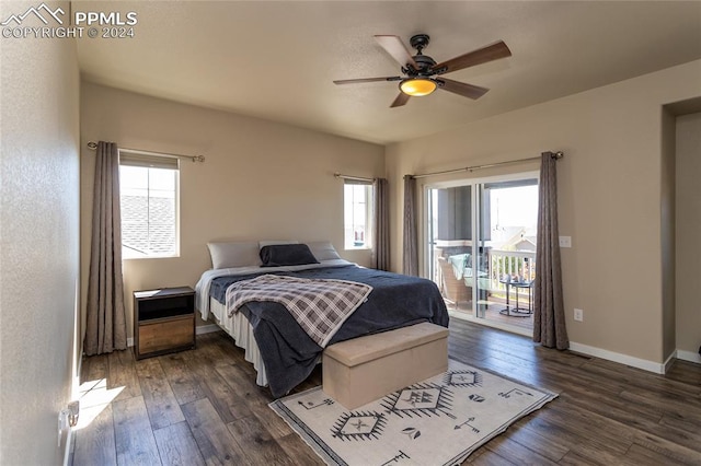 bedroom featuring multiple windows, access to exterior, and dark hardwood / wood-style flooring