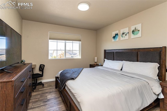 bedroom with wood-type flooring