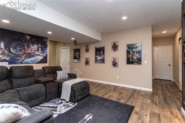 home theater room featuring hardwood / wood-style floors