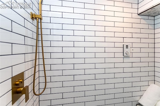 bathroom with tiled shower