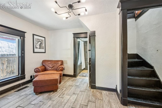 sitting room with light hardwood / wood-style floors