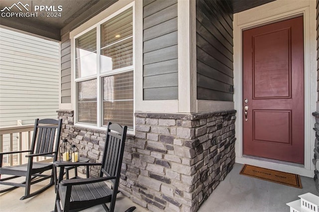 doorway to property with covered porch