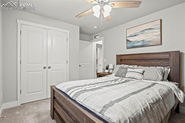 carpeted bedroom with a closet and ceiling fan