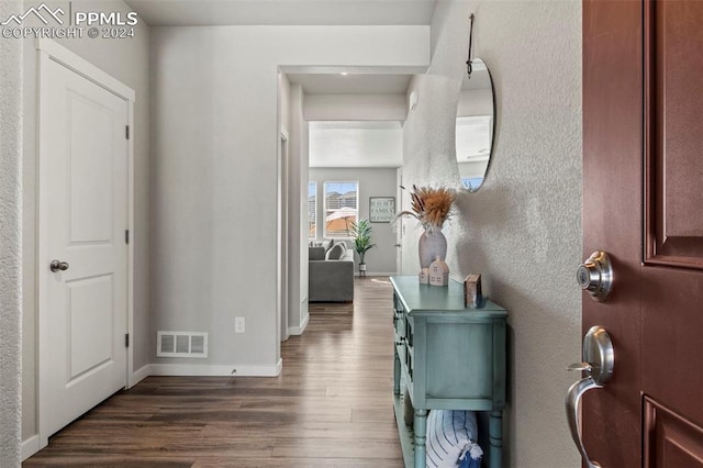 entryway with dark hardwood / wood-style floors