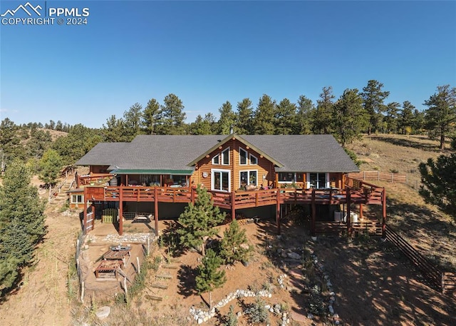 rear view of house with a deck