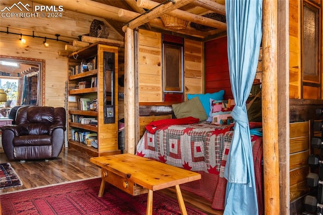 interior space featuring wood walls and hardwood / wood-style floors