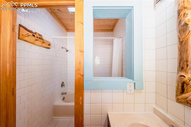 bathroom featuring tile walls, shower / tub combo with curtain, wooden ceiling, and vanity