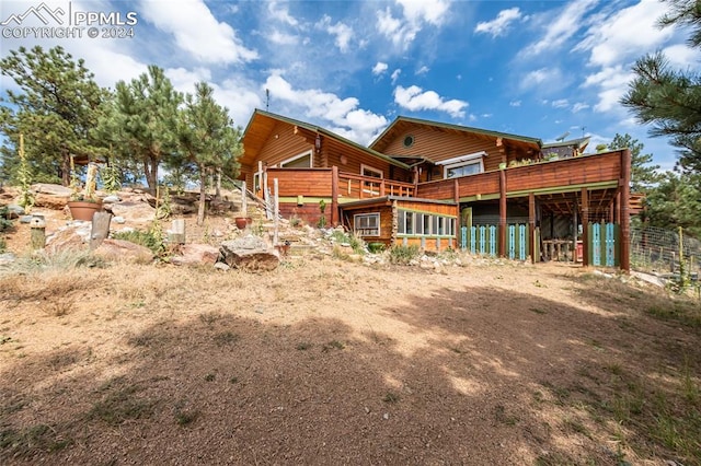 back of property with an outbuilding