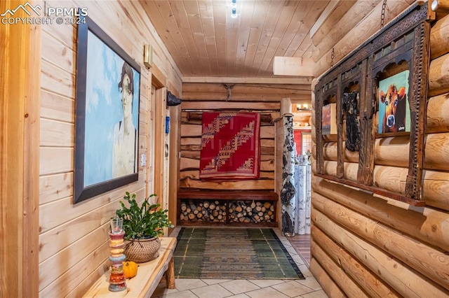 interior space with wood ceiling and tile patterned flooring