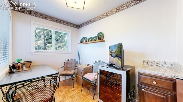 home office featuring light parquet flooring and wine cooler