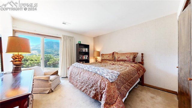 bedroom featuring light colored carpet