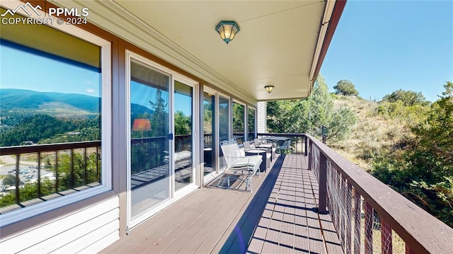 balcony featuring a deck with mountain view