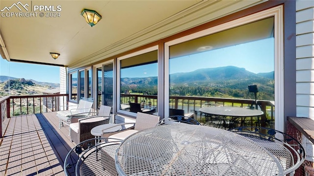 wooden terrace featuring a mountain view