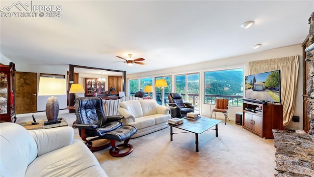 living room featuring ceiling fan and light carpet