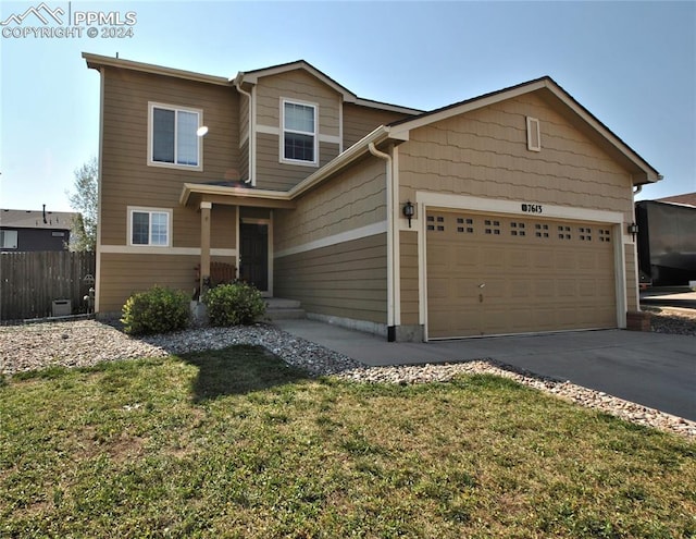 view of front facade with a front lawn and a garage