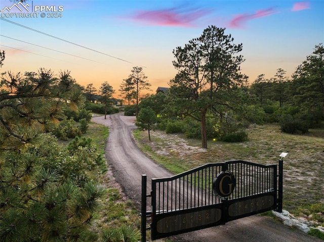 view of gate at dusk