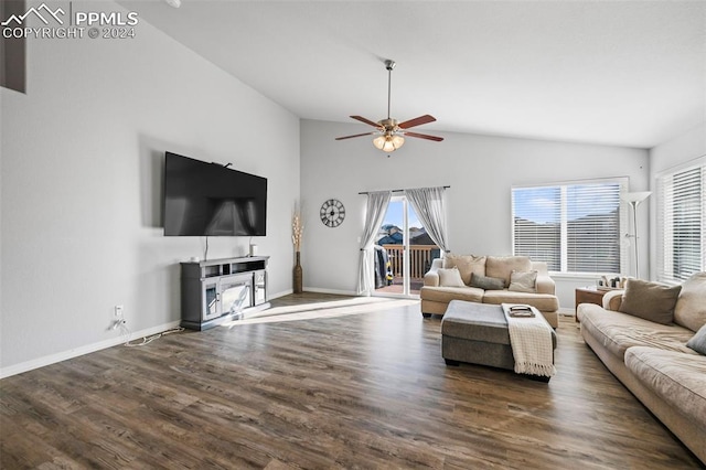 living room with ceiling fan, dark hardwood / wood-style flooring, and high vaulted ceiling