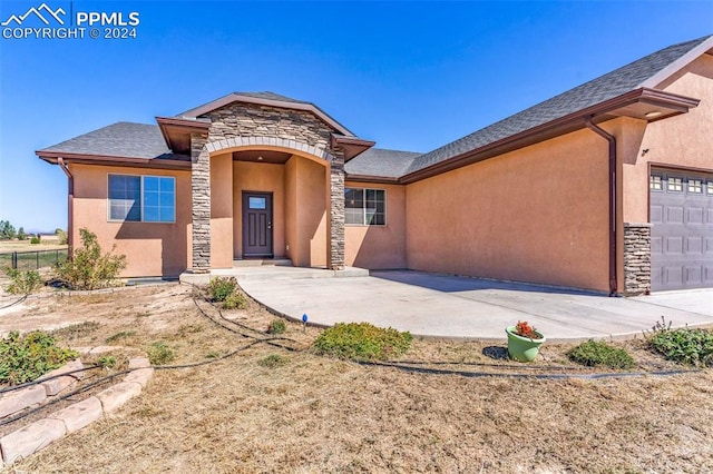 view of front of property with a garage