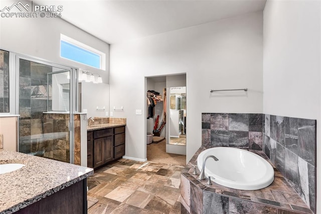 bathroom featuring vanity and plus walk in shower