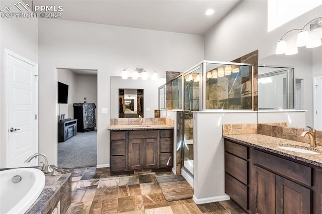 bathroom featuring vanity and plus walk in shower