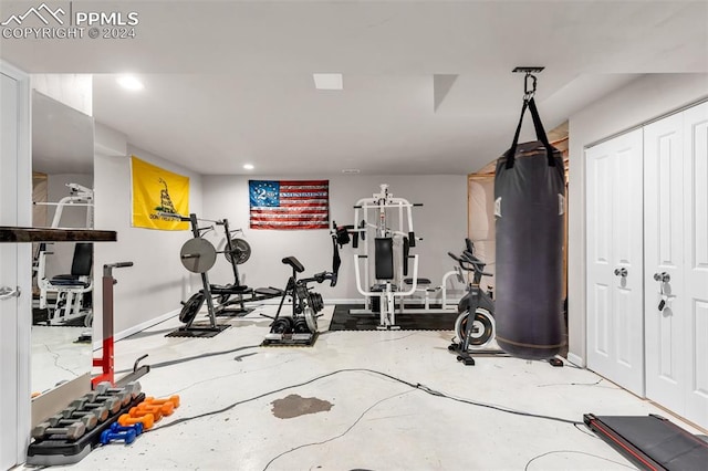 workout area featuring concrete flooring