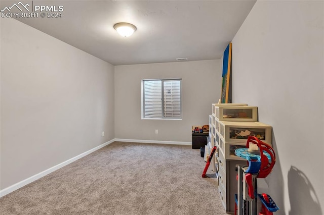 game room featuring light colored carpet