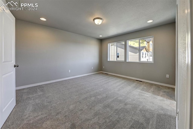 empty room with carpet flooring