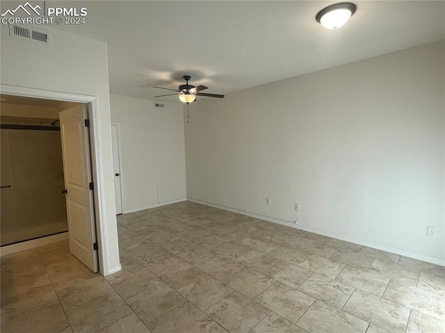 unfurnished room with ceiling fan