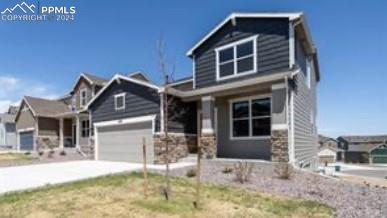 craftsman inspired home with a garage