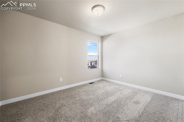 empty room featuring carpet flooring