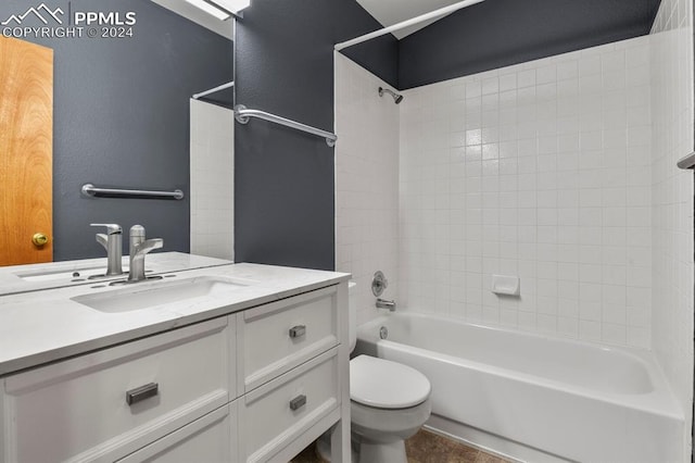 full bathroom featuring tiled shower / bath combo, vanity, and toilet